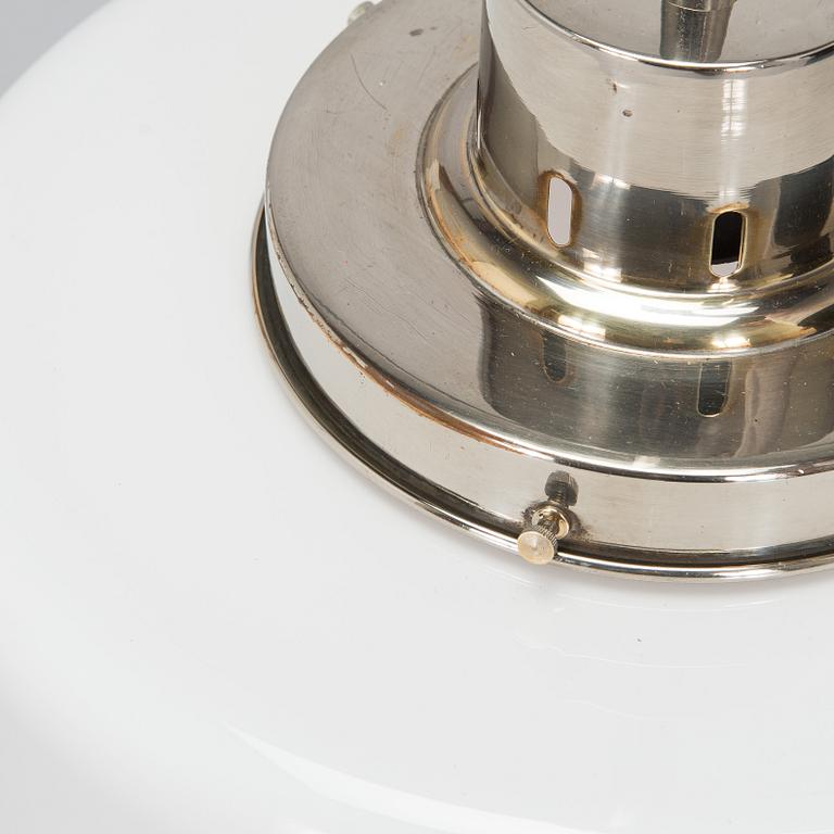 Paavo Tynell, kattovalaisin, malli 2004, Taito 1930-luku.