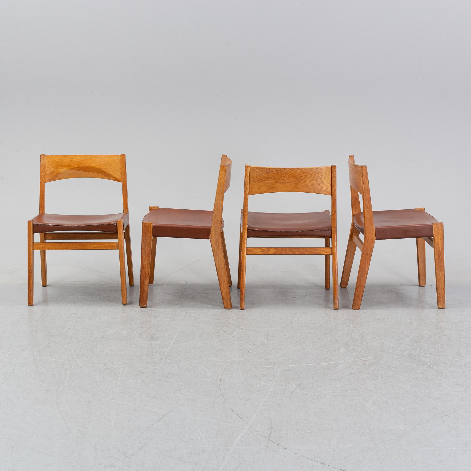 Four oak chairs with leather seat by John Vedel Rieper, Denmark, 1962.