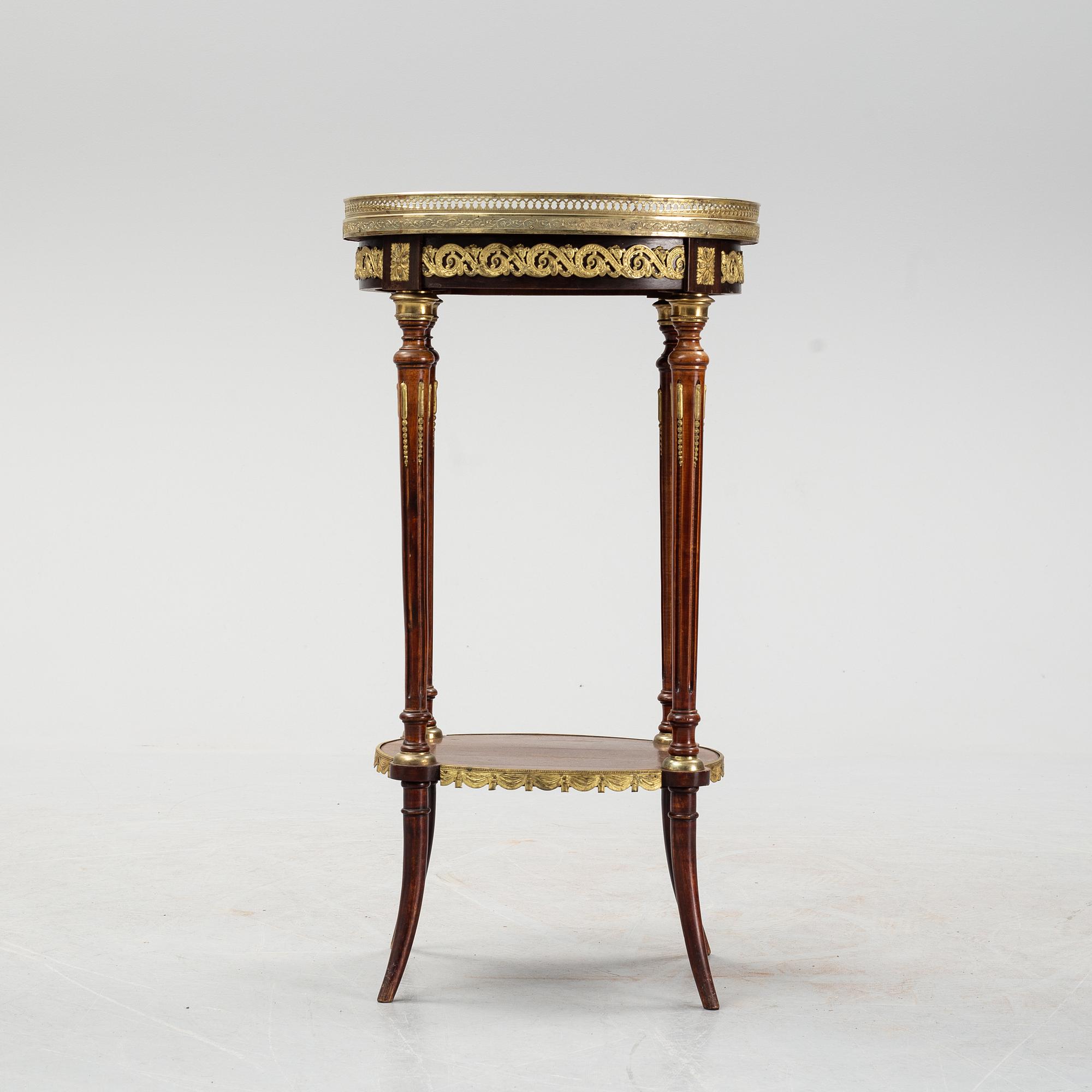 A French Louis XVI-style table, first half of the 20th century.