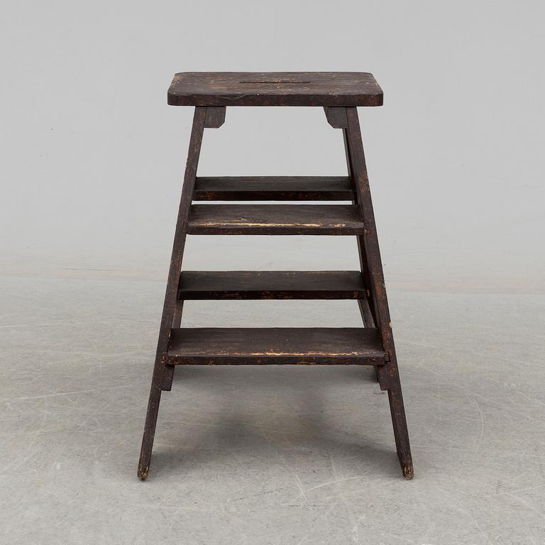 a late 19th century pinewood stool.