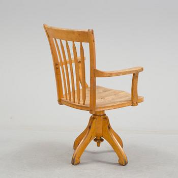 a writing desk chair from the early 20th century.