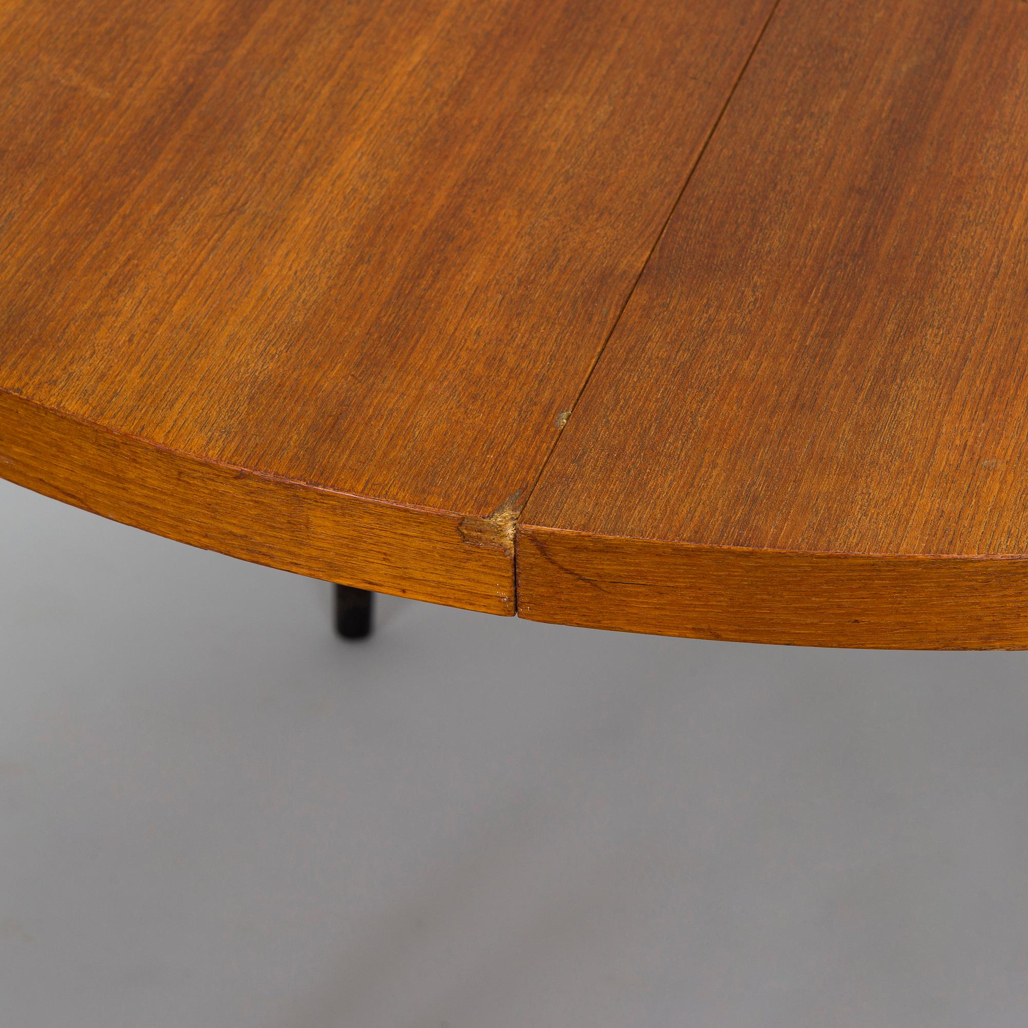 A mid-20th century dining table.