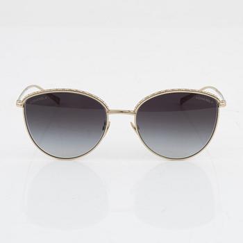Chanel, a pair of gold tone and crystal sunglasses.