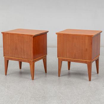 A pair of teak veneered bedside tables, mid 20th century.