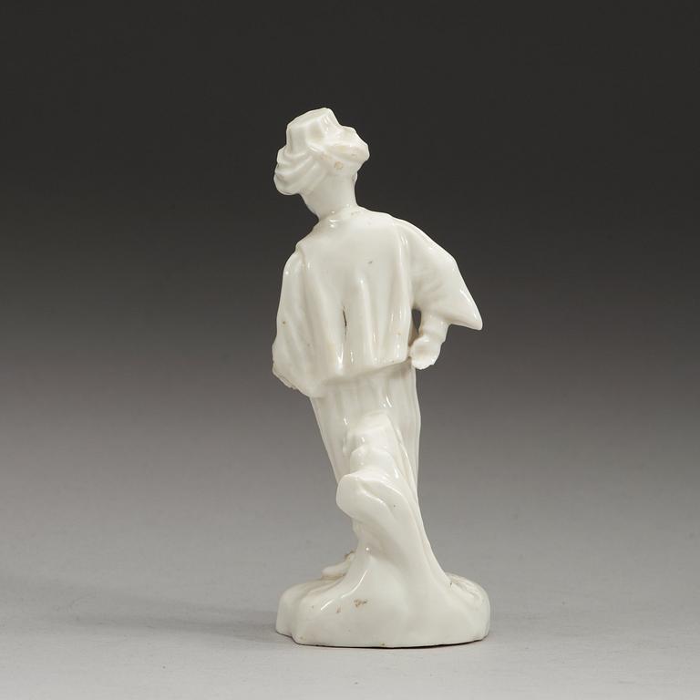 A Swedish Marieberg soft paste figure of a boy clad in Turkish garments, 18th Century.