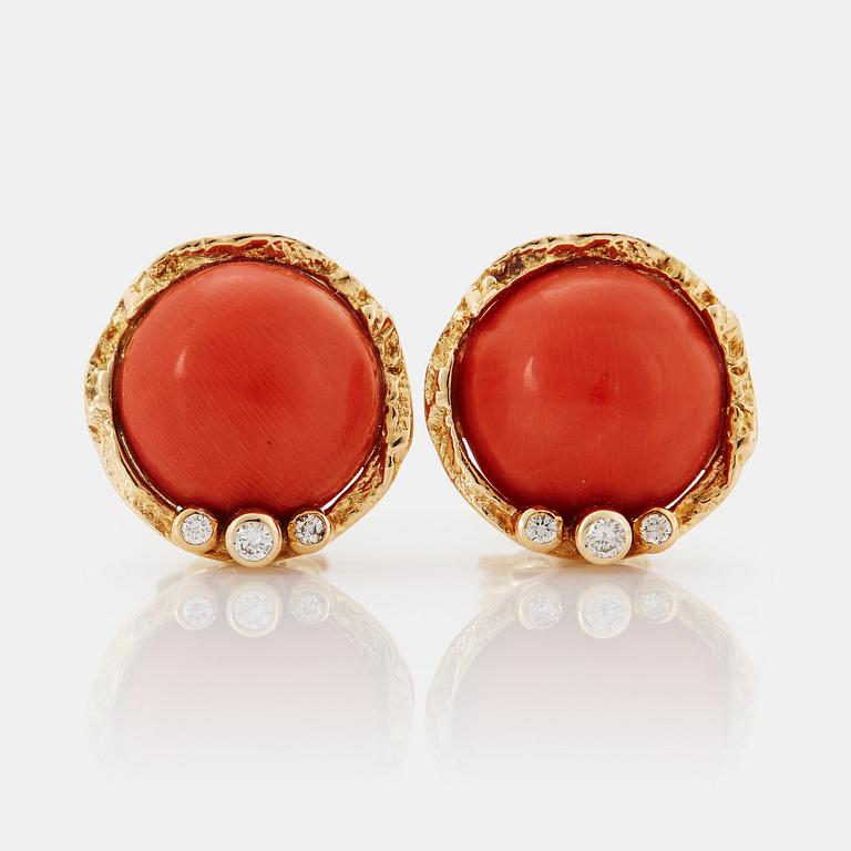 A pair of 18K gold earrings set with coral and round brilliant-cut diamonds.