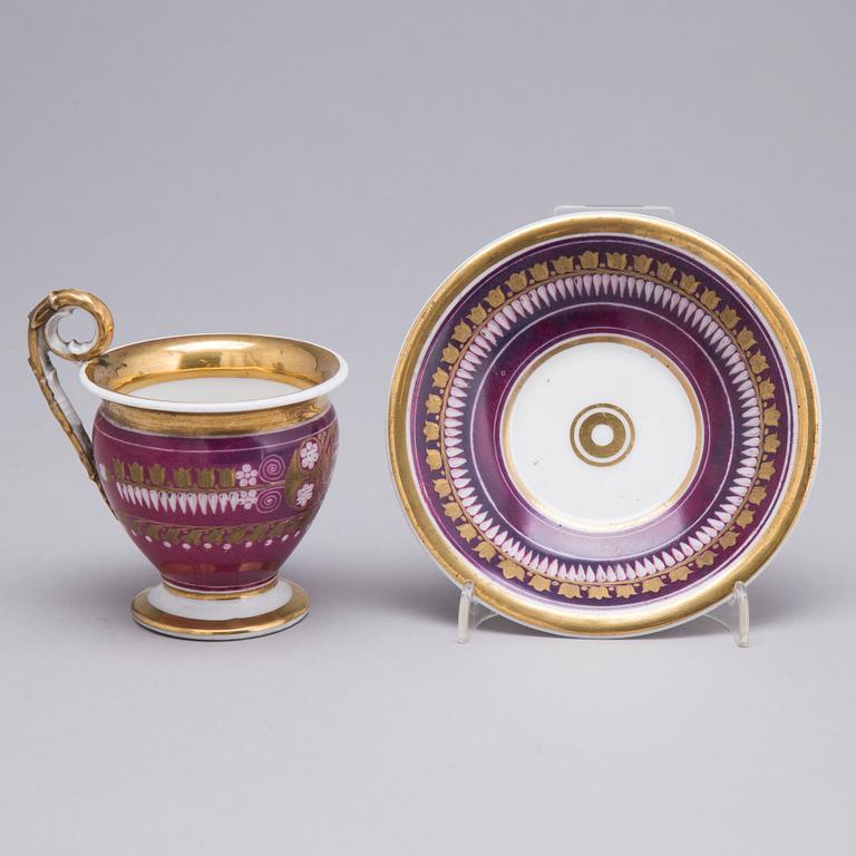 AN EMPIRE PORCELAIN CUP AND SAUCER, first half of the 19th century.