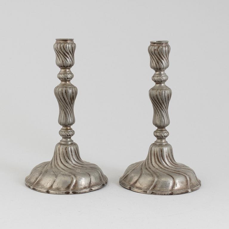 A PAIR OF ROCOCO PEWTER CANDLESTICKS, 18th century.