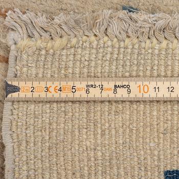 A semi-antique China/Nepal carpet, c, 385 x 297 cm.