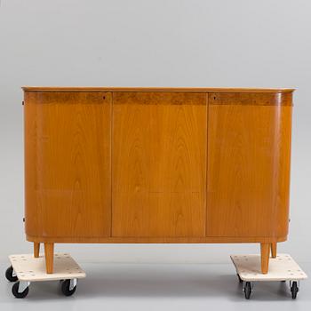 A Swedish Modern elm cabinet, 1930's/40's.