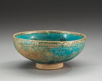 BOWL, pottery. Turquoise glaze with black decoration. Persia 13th century, probably Kashan.