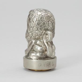 An Anna Petrus pewter and brass seal by Svenskt Tenn 1981.