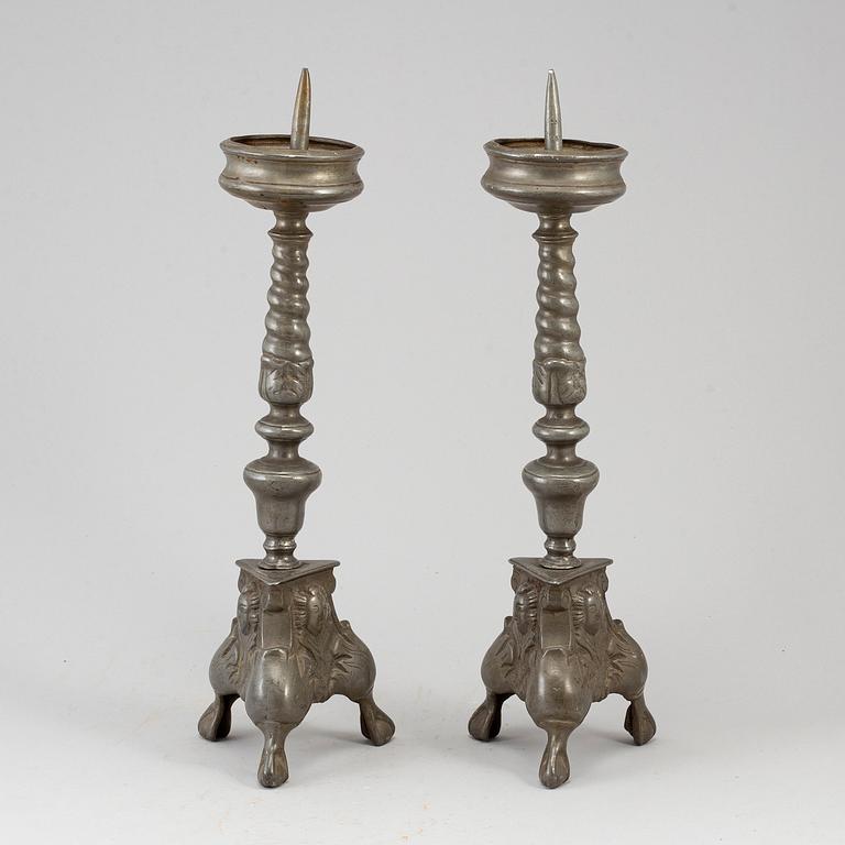 A pair of 17th century pewter candlesticks.