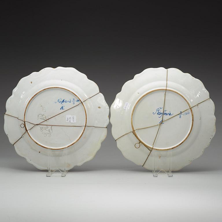 A pair of Swedish faience chargers, Rörstrand, dated 3/8 (17)64.