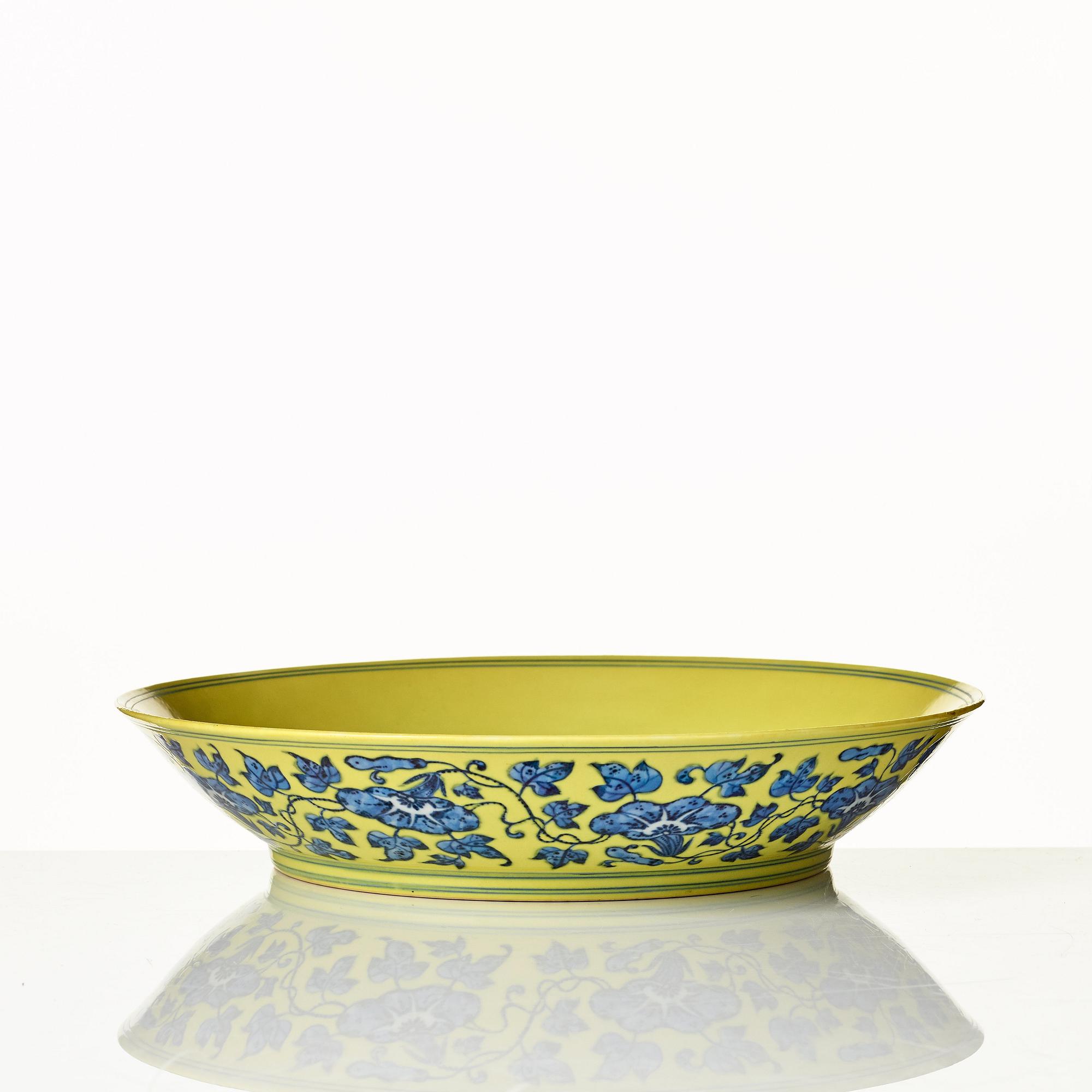 A large yellow ground underglaze blue peach dish, Qing dynasty, Qianlong six character mark (1736-1795).