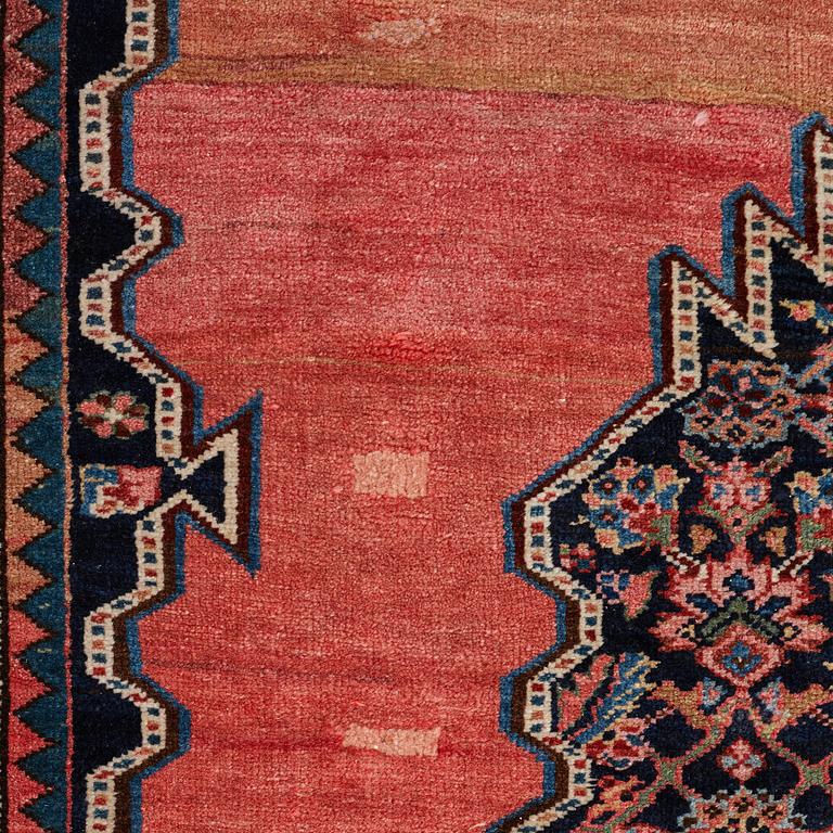 A CARPET, an antique Bidjar kelly, ca 587 x 230 cm.