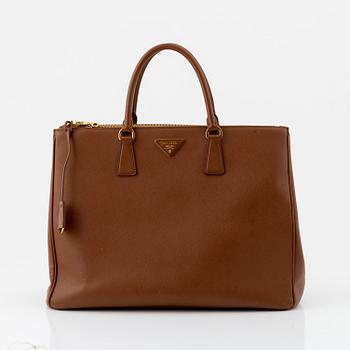 Prada, a brown Saffiano handbag.