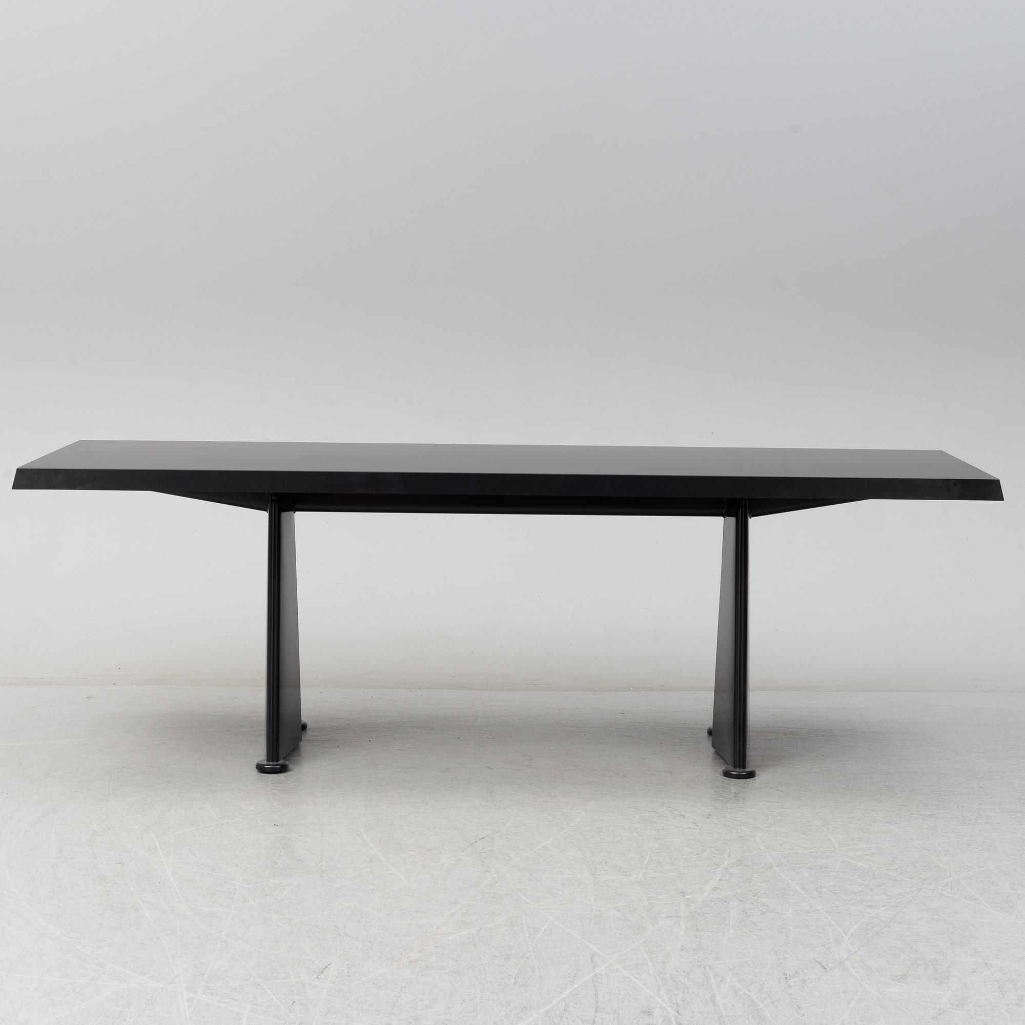 A 'Trapeze' dinner table by Jean Prouvé, Vitra, 2002.