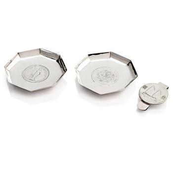 1042. Two silver coasters and a money clip, China, early 20th century.