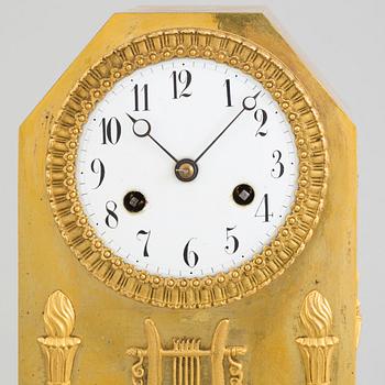 A circa 1800 brass mantel clock.