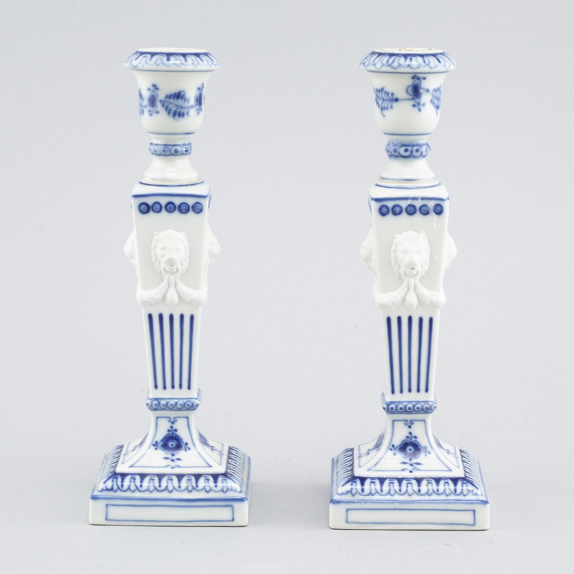 A pair of "Musselmalet" candlesticks in porcelain, by Royal Copenhagen, second half of the 20th century.