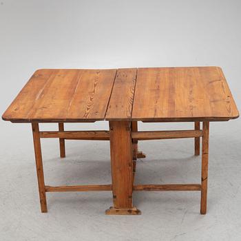 A pine gate-leg table, 19th Century.