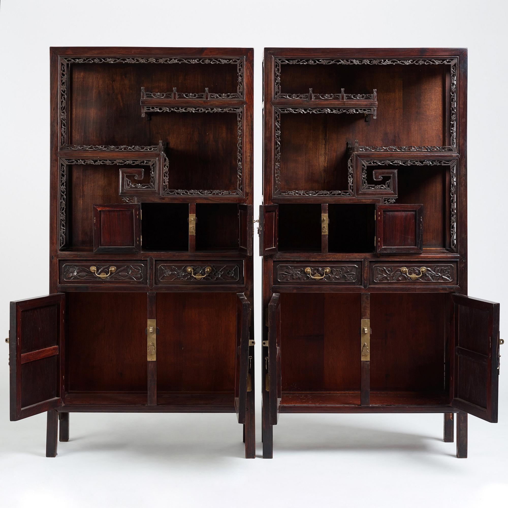 A pair of Chinese hardwood display cabinets, Qing dynasty, 19th Century.