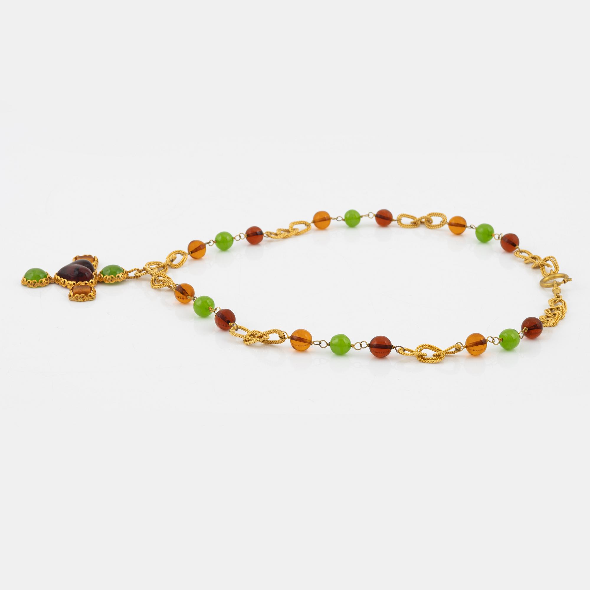 Chanel, A gold metal and rhinestone necklace.