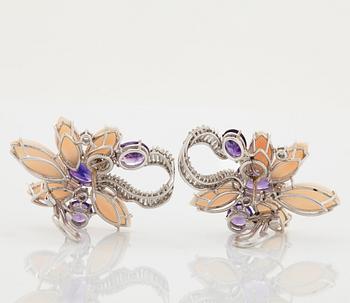 A pair of 18K white gold earrings set with faceted amethyst and coral.