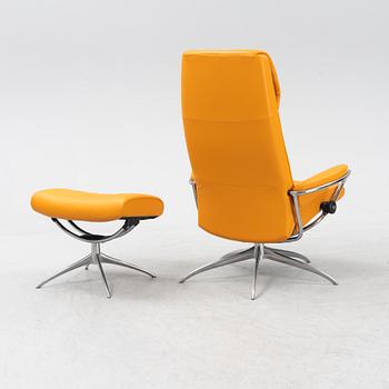 A 'London' stressless easy chair with foot stool, Norway.