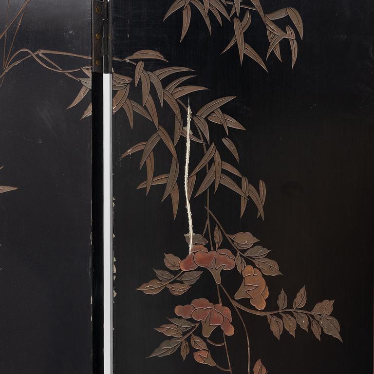 A Chinese lacquer folding screen, 20th century.