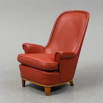 A 1930's leather upholstered 'Paris' lounge chair by Carl Axel Acking.