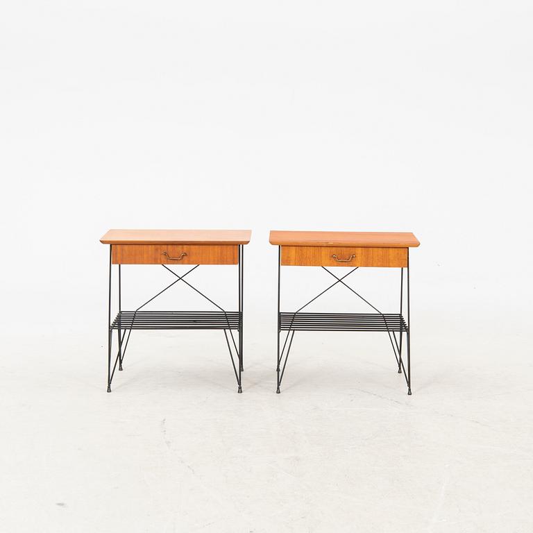 A pair of 1950s teak bedside tables.