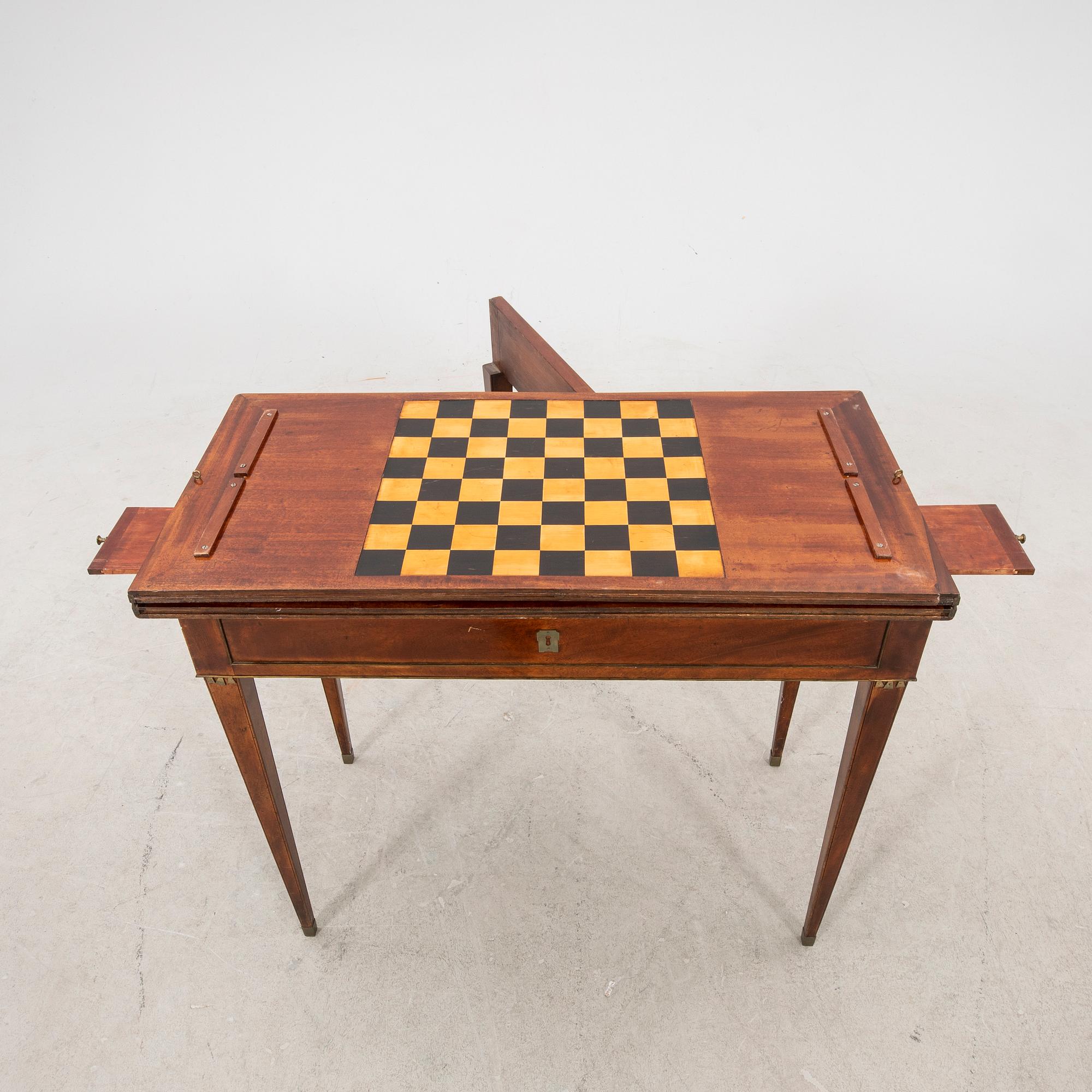 A late Gustavian mahogany game table first half of the 19th century.
