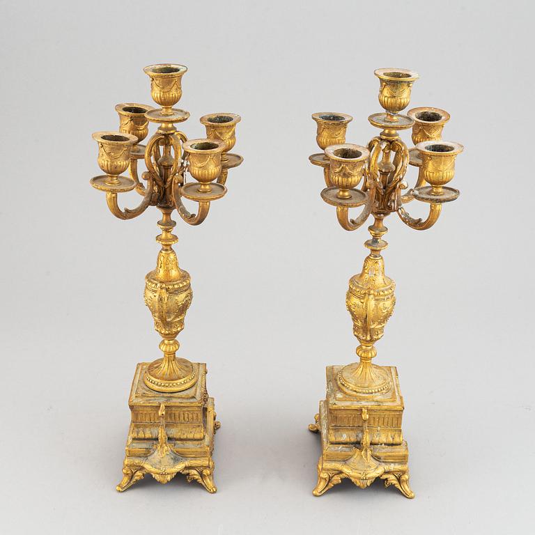 A late 19th century table clock and candelabra, probably France.