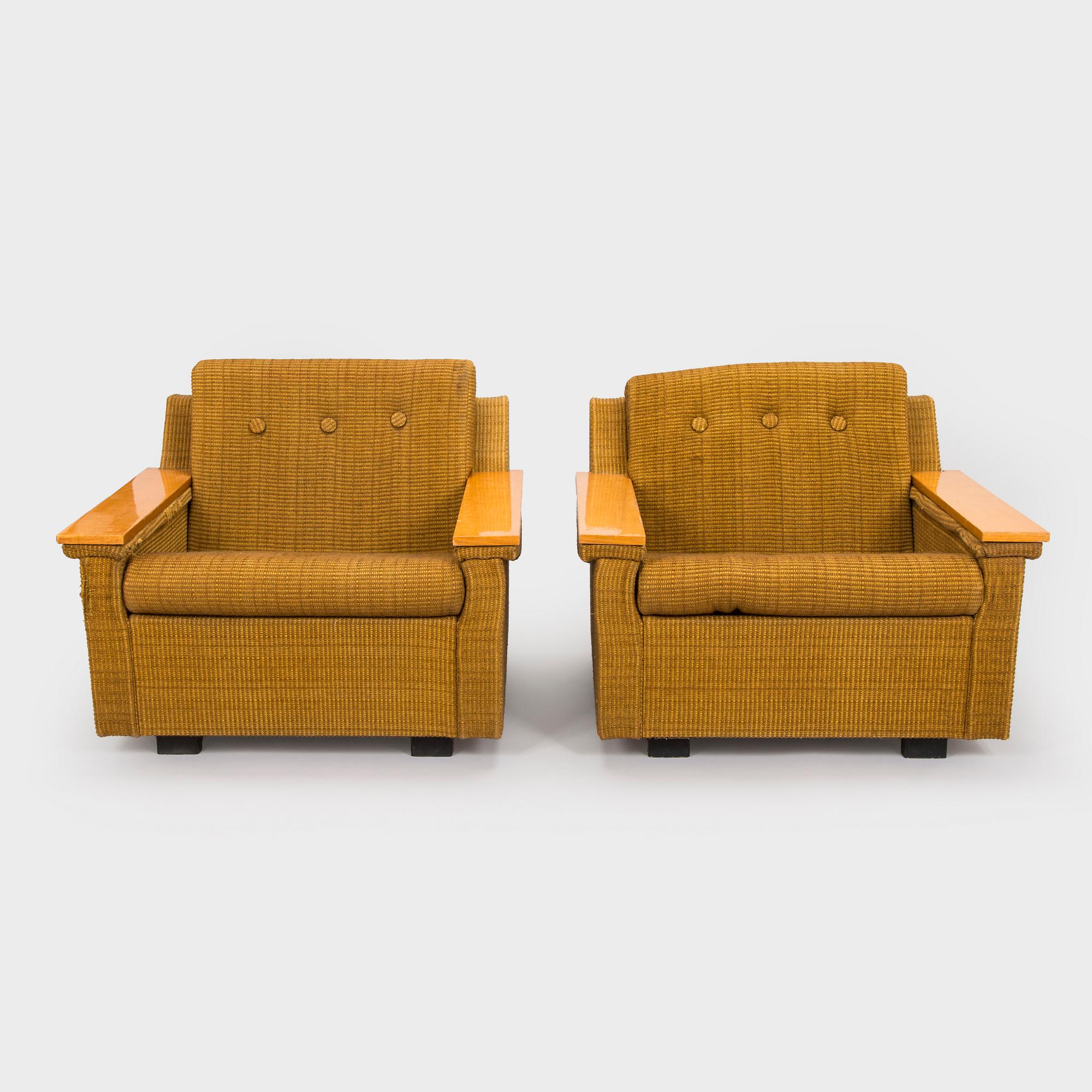 A pair of 1970s armchairs.