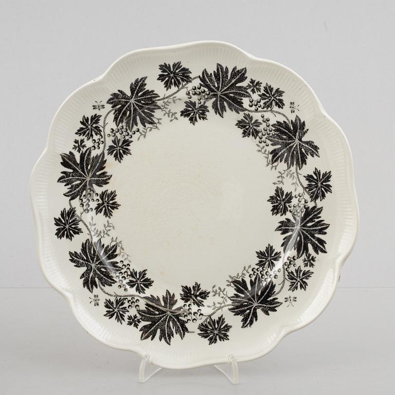 Arthur Percy, 57 pieces of a "Vinranka" creamware service, Gefle, Sweden, first half of the 20th century.