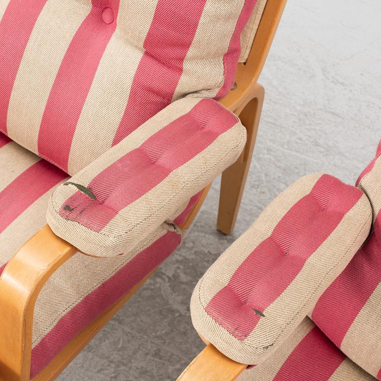 Bruno Mathsson, a pair of "Ingrid" armchairs, Dux, Sweden, second half of the 20th century.