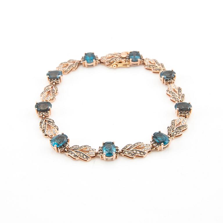 Bracelet in 14K rose gold with round brilliant-cut diamonds and oval faceted topazes, LeVian.