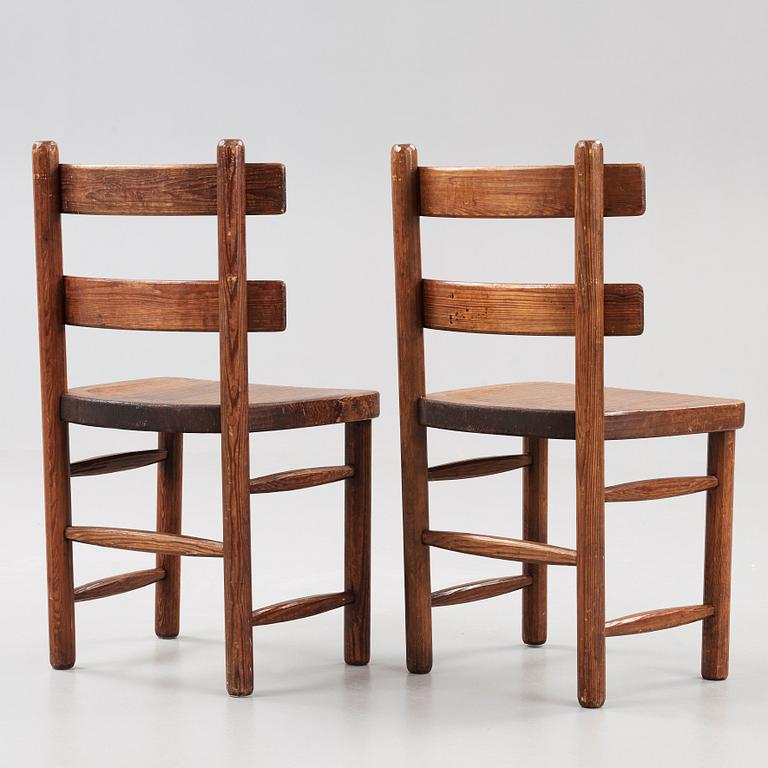 A pair of Axel Einar Hjorth stained pine 'Sandhamn' chairs.