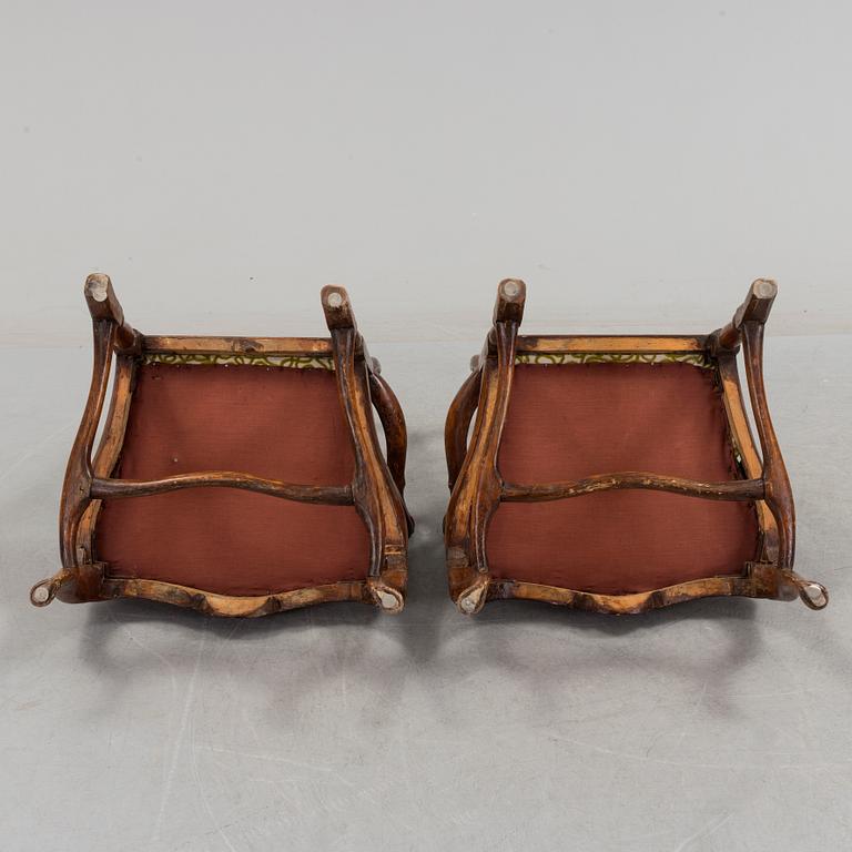 A pair of rococo arm chairs, later part of the 18th century.