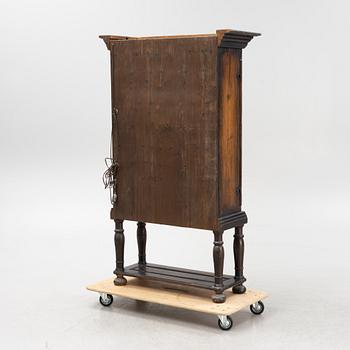 A Baroque style cabinet on later stand, first part of the 18th Century.
