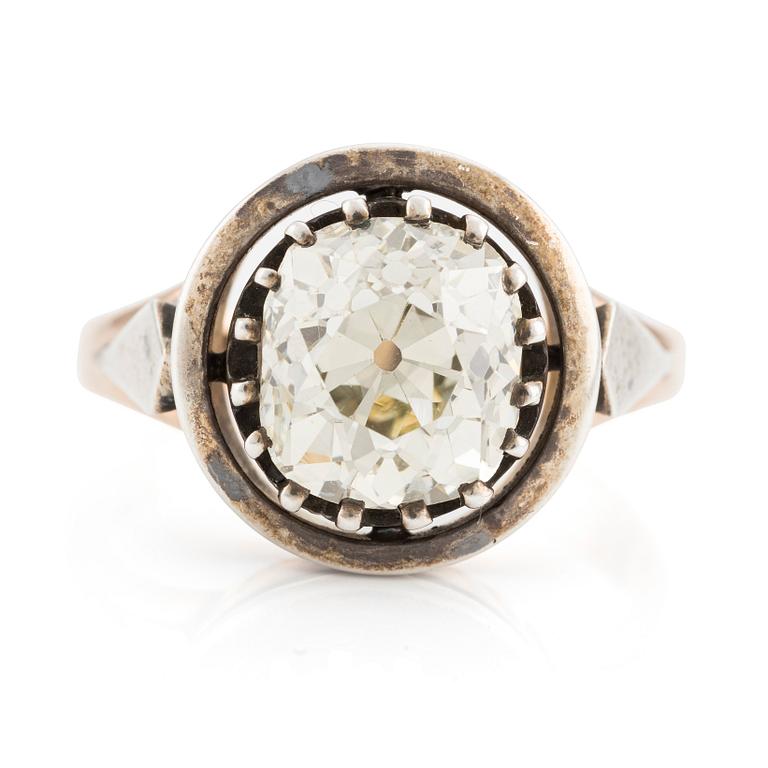 A 14K gold and silver ring with an old-cut diamond.