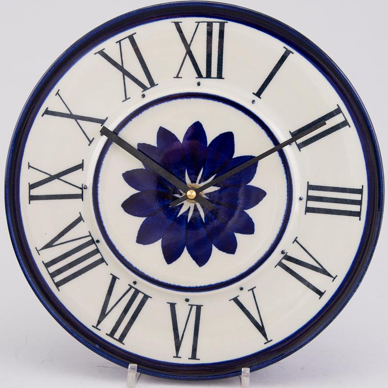 MARIANNE WESTMAN, A wall clock and nine  pieces of the Rörstrand 'Mon Amie' table ware.