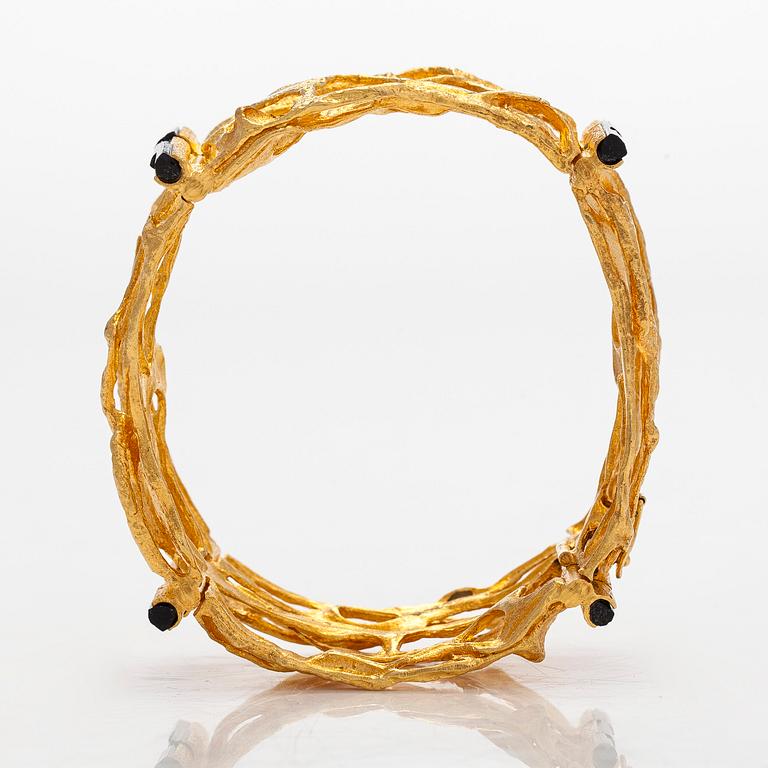Björn Weckström, an 18K gold and tourmaline 'Sacrificial fire' bracelet. Lapponia 1971.
