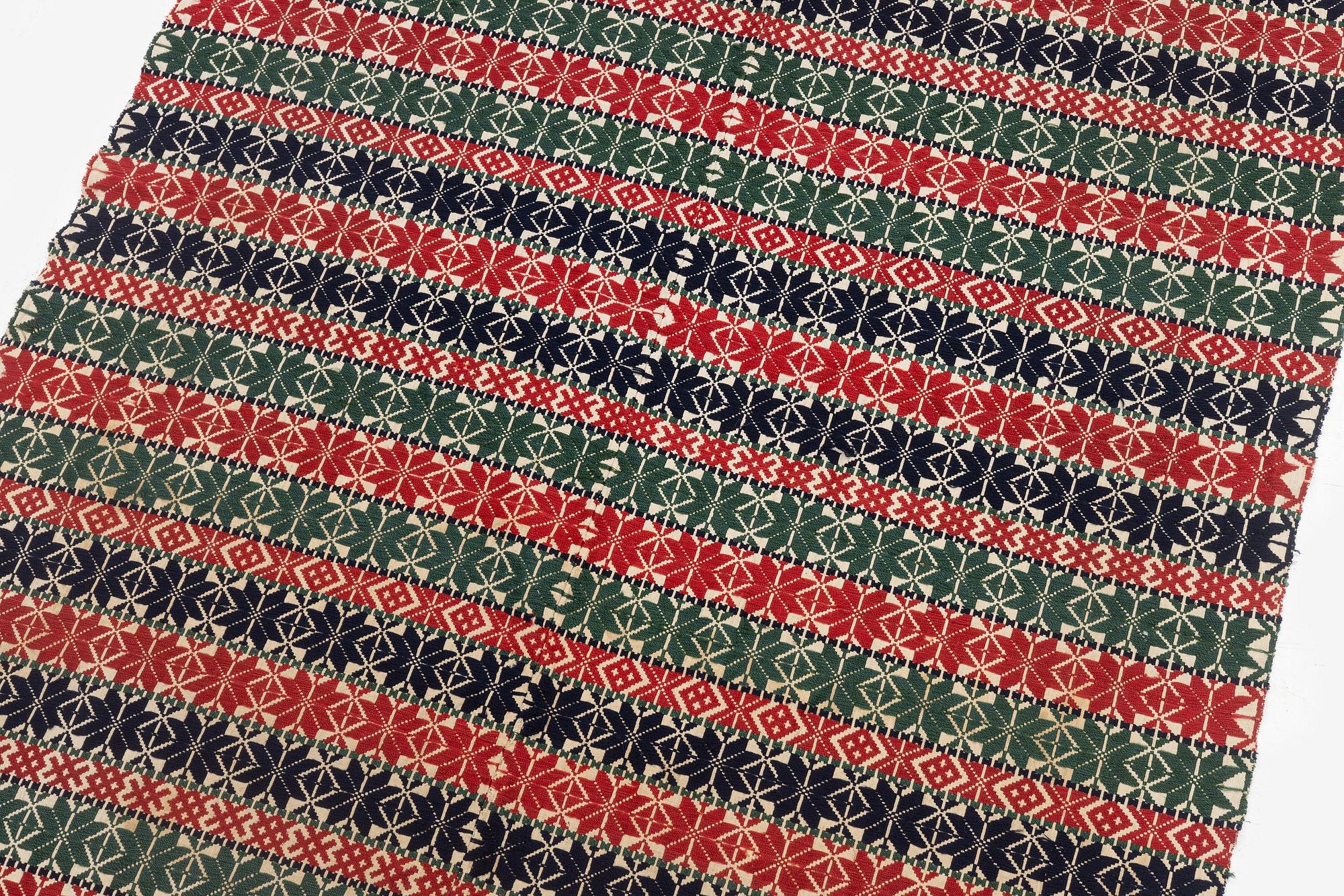 A bed cover in weft-patterned tabby type, c. 180 x 126, Scania, Sweden, first half of the 19th century.