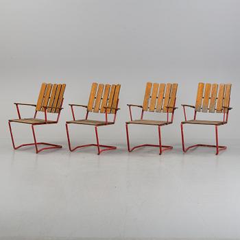 A garden table and four chairs, 20th century.