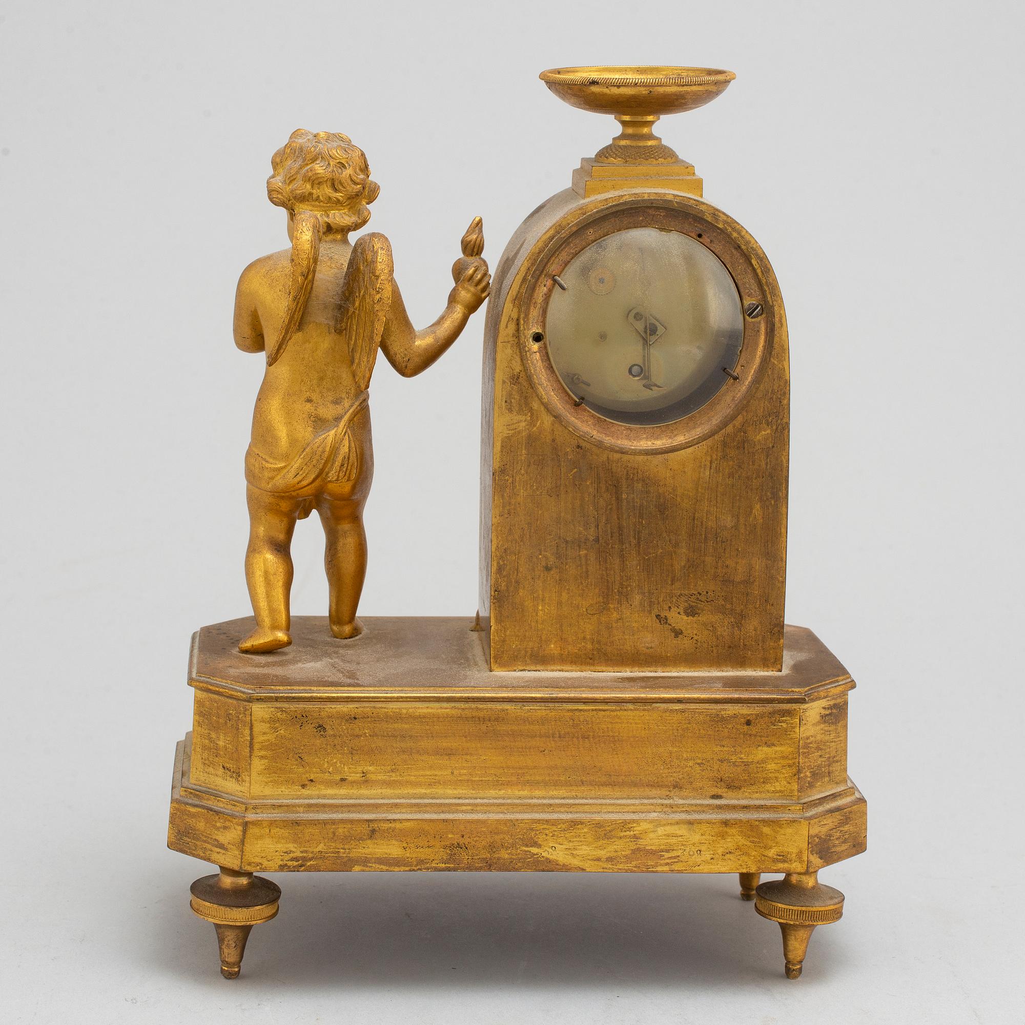 A German Empire mantel clock, early 19th century.