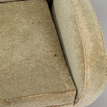 A pair of mid-20th century armchairs.