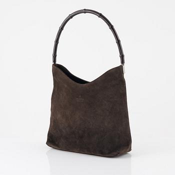 Gucci, a Bamboo suede bag.